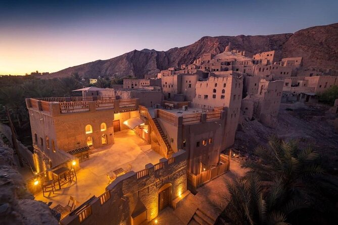 Amouage & Nizwa Full-Day Tour: Fort, Souq & Barakat Al Mouz - Birkat Al Mouz, date palms, and old ruins