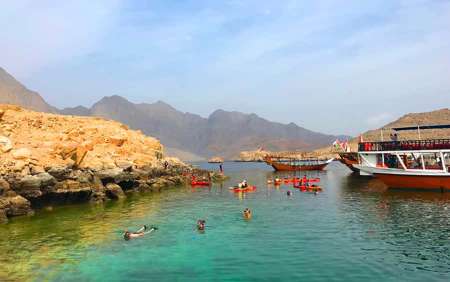From Dubai: Musandam Khasab Tour with Boat Trip and Safari - Telegraph Island swimming and snorkeling stop