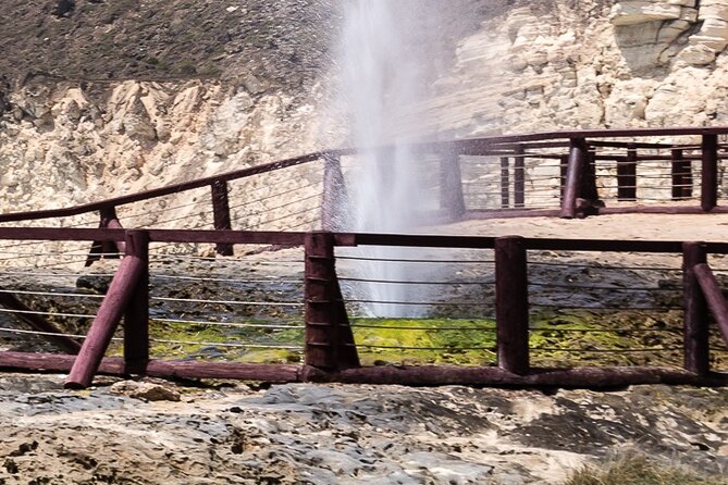 Full-Day Private Salalah West Tour with Lunch - Al Mughsail Beach, palm shade, and mountain walls