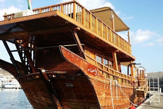 Omani Traditional Dhow Cruise: Sunset and Muscat Coastal View - Omani coffee, dates, and simple refreshments
