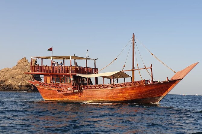 Omani Traditional Dhow Cruise: Sunset and Muscat Coastal View - Al Bustan Palace from the water