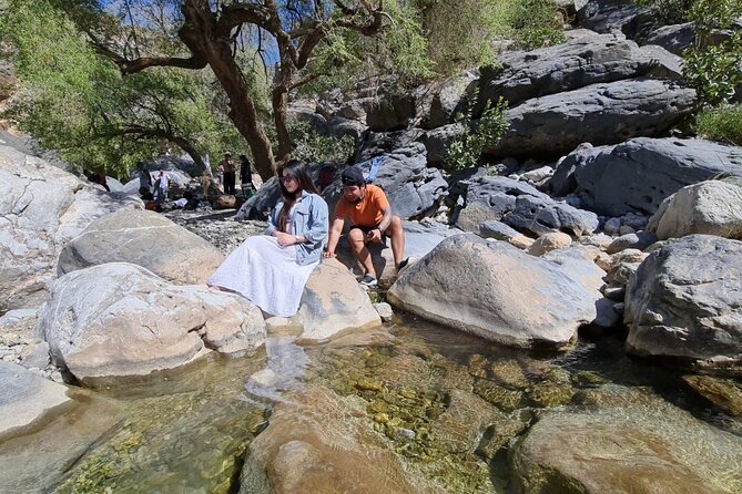 Private Full Day Wadi Dham Tour - Walking across the first rocks