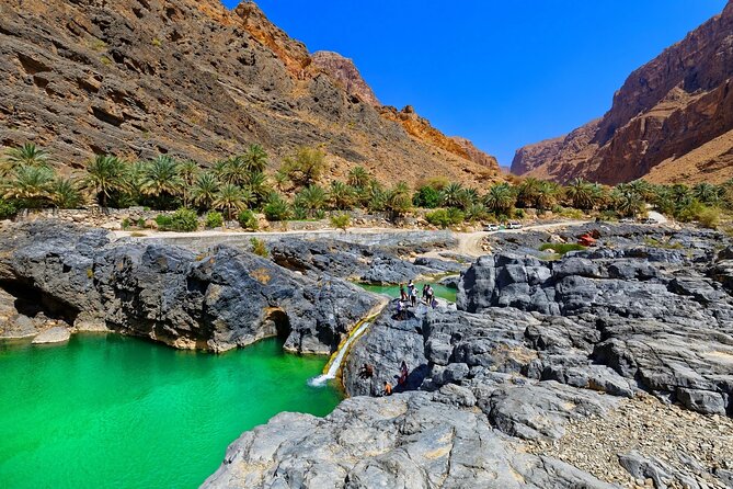 Wadi Arbeieen Tour - The main pool, small waterfall, and cliff jumps