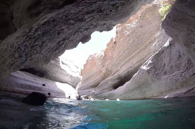 Wadi Shab and Bimmah Sinkhole 4X4 (Private Tour ) - Swimming toward the keyhole and waterfall
